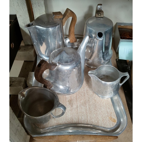 108B - Six pieces of Picquot ware, tray, two coffee pots, a teapot and two milk jugs
