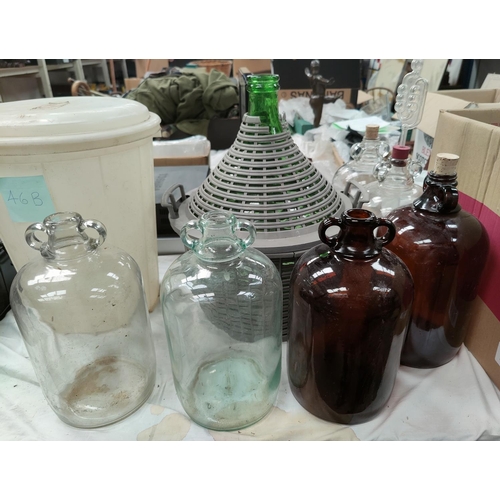 46B - A large selection of wine making equipment including 12 demijohns etc