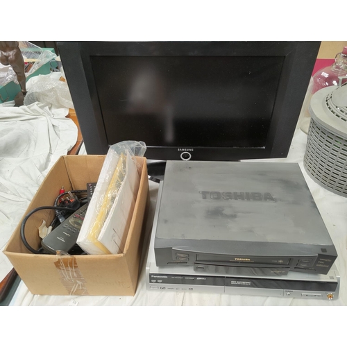 46C - A vintage VHS player, DVD player and recorder and a tv