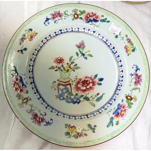 307A - A Chinese 19th century plate with central polychrome floral arrangement and floral border and fluore... 