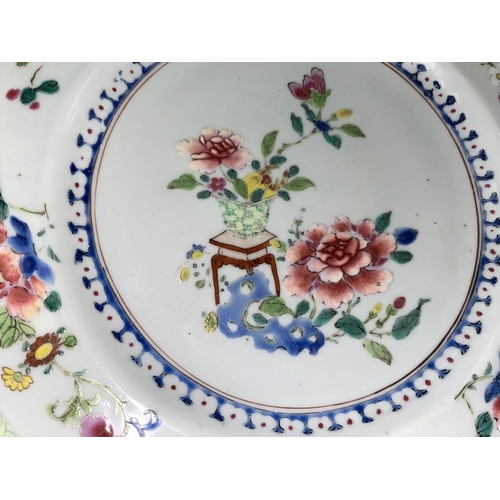 307A - A Chinese 19th century plate with central polychrome floral arrangement and floral border and fluore... 