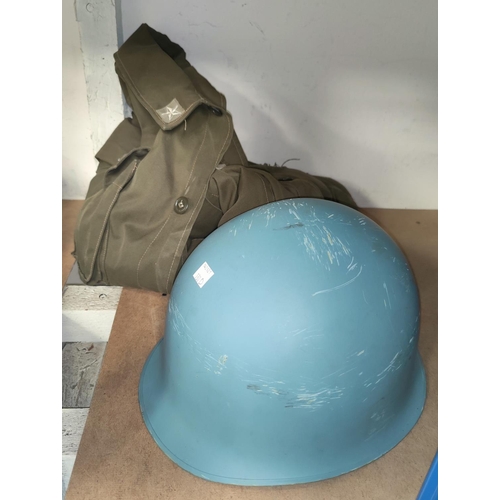 130D - An Italian tin helmet and a soldiers jacket