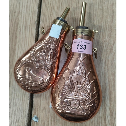 133 - A brass mounted copper flask American style embossed decoration, 20cm and another similar, 16cm