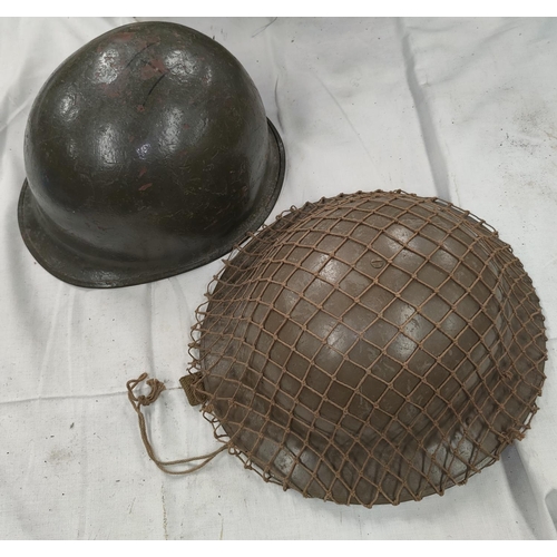165 - A British pattern steel helmet with webbing and a helmet shell.