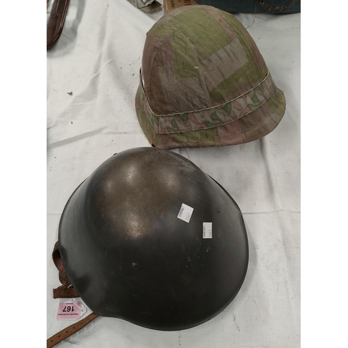 167 - A steel combat helmet with leather and nylon lining, another helmet with a canvas camouflage cover.