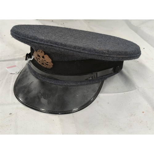 169 - A mid 20th century Royal air Force cap with a brass badge, dated 1952
