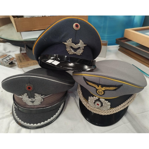170 - Three reproduction German military caps.