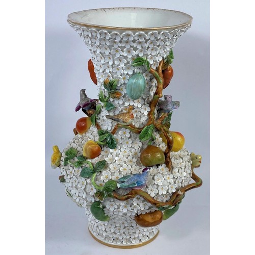 436A - A continental heavily encrusted vase, woven with branches and vines decorated with fruit and birds i... 