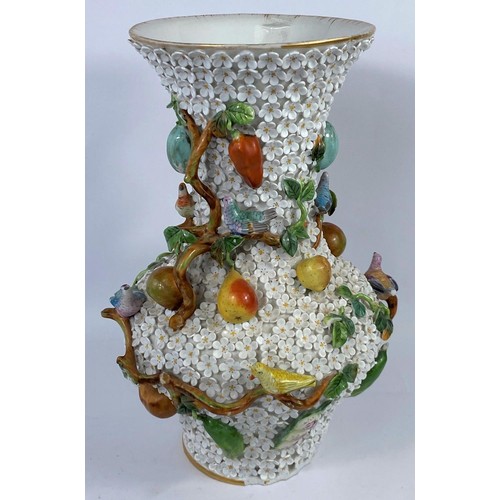 436A - A continental heavily encrusted vase, woven with branches and vines decorated with fruit and birds i... 