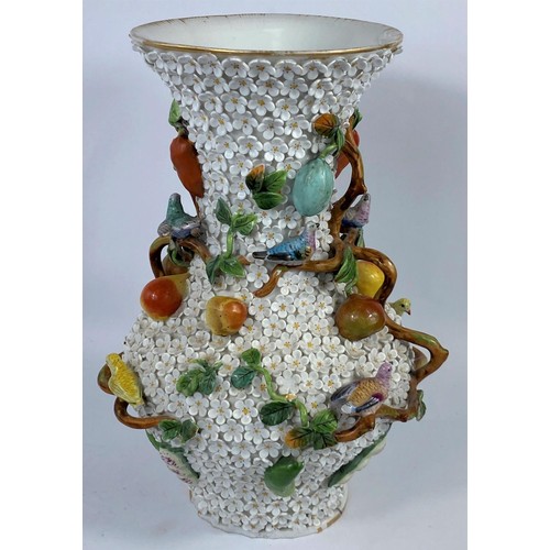 436A - A continental heavily encrusted vase, woven with branches and vines decorated with fruit and birds i... 