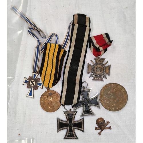 182 - A German Iron Cross and five others items