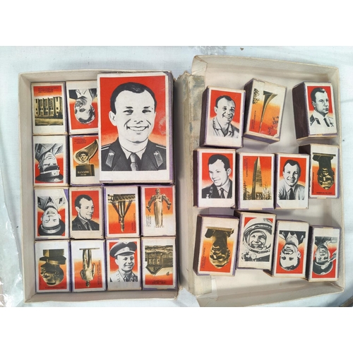 217A - SOVIET COSMONAUTS: a large matchbox paper over wood with a photograph of Yuri Gagarin and 23 similar... 