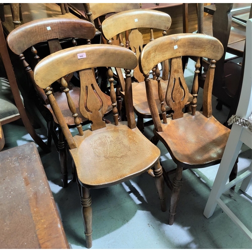 682 - A 19th century set of matched 7 beech kitchen chairs with fiddle backs
