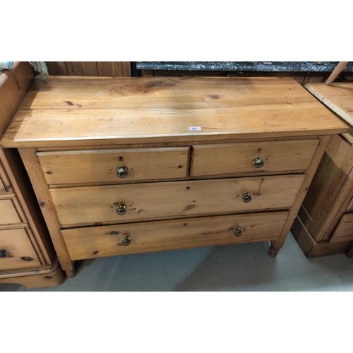 683 - A stripped pine chest of 2 long and 2 short drawers