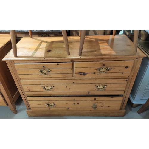 684 - An Edwardian stripped pine chest of 2 long and 2 short drawers