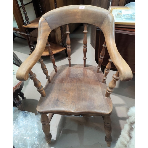 726 - A 19th century beech and elm spindle back armchair; a rush seat ladder back armchair