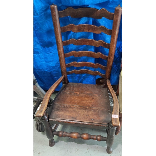 841 - A Country made oak ladder back low seat and arm chair with a solid seat.