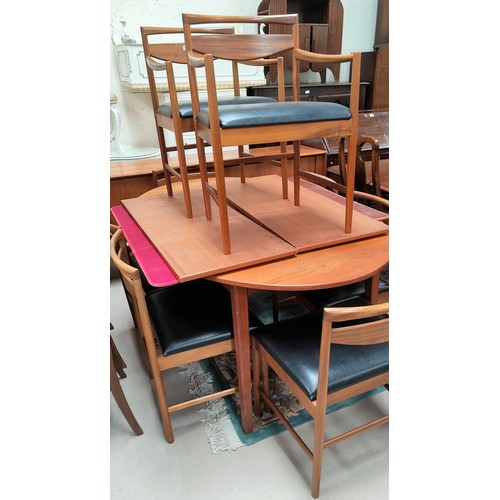 715 - A 1960's dining suite comprising G-Plan teak extending table with 2 leaves, extended length 260 cm, ... 