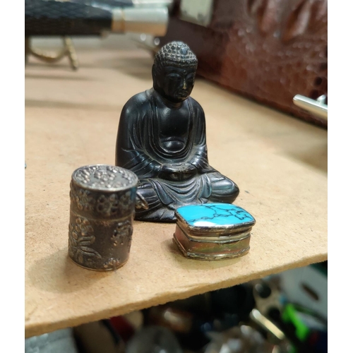106 - A small bronze Buddah, a resin bronzed barn owl and a selection of collectables.