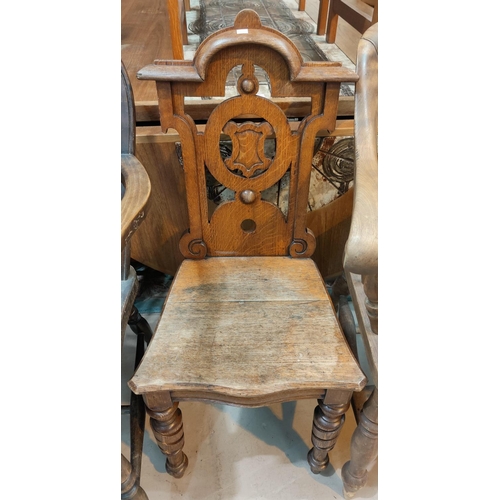 837 - An Art Noveau folding chair with tapestry seat and back; an oak hall chair