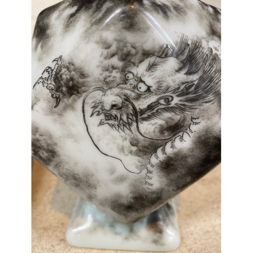 390H - A Chinese ceramic vase of canted square form, with thin neck, decorated in monochrome with a dragon ... 