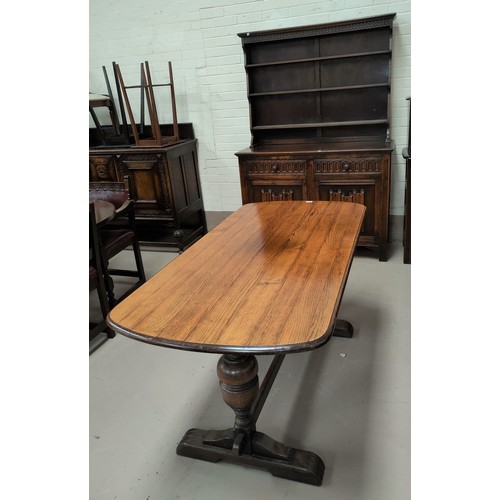816 - A reproduction oak dining suite with linen fold decoration comprising refectory table; 6 ladder back... 