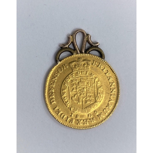 447 - GB: a George III Half Guinea, 1809 with gold jewellery mount