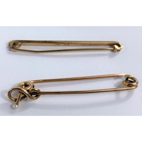 631 - A yellow metal plain bar brooch, stamped '9ct'; a yellow metal pearl set bar brooch, unmarked tests ... 