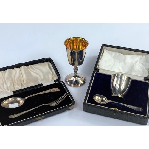 636 - A hallmarked silver goblet, Birmingham 1974; a christening egg cup and spoon, boxed, Sheffield 1934;... 