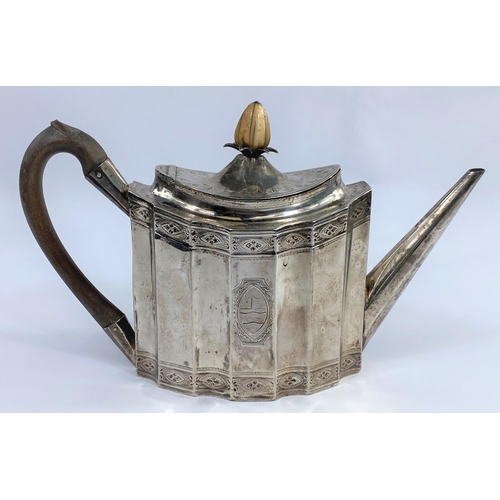 644 - A Georgian oval ribbed teapot with chased decoration and crest, London 1810, 14.5 oz - this teapot h... 
