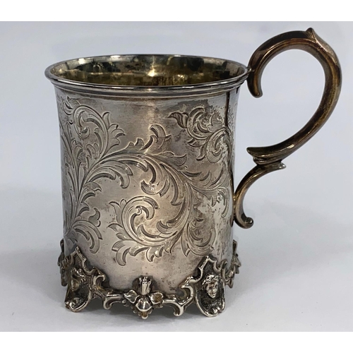 649 - A Victorian silver cylindrical christening mug with chased acanthus decoration and cst foot rim, Lon... 