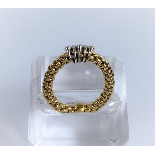 677 - A woven yellow metal ring stamped 