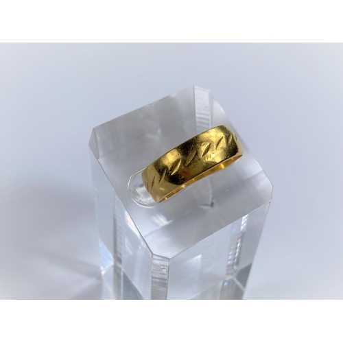 678 - A 22ct hallmarked gold wedding ring 5.7gms. size Q/R