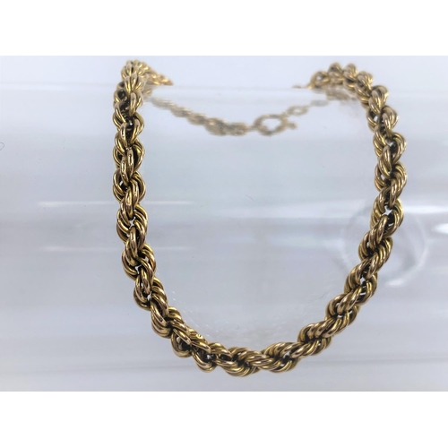 688 - A 9ct hallmarked gold rope twist yellow metal bracelet, 4.7gms.