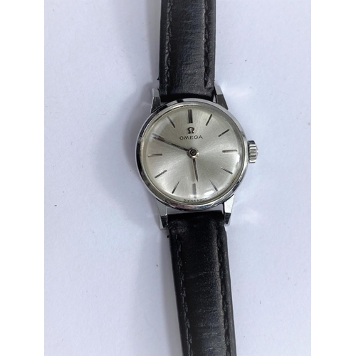 694 - A ladies omega stainless steel wrist watch; a modern Mickey Mouse wrist watch and three other ladies... 
