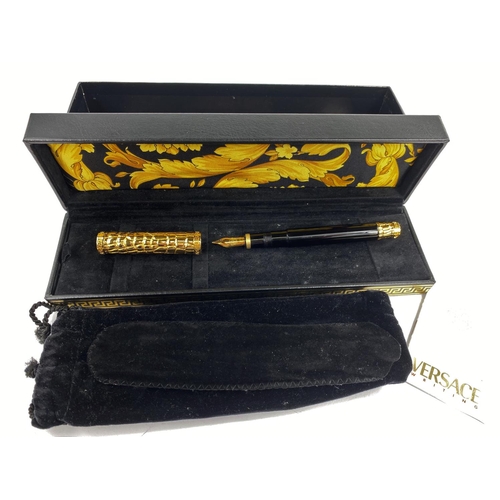 131 - A boxed Versace fountain pen made by Omas with 
gilt crocodile skin effect highlights on lid and end... 
