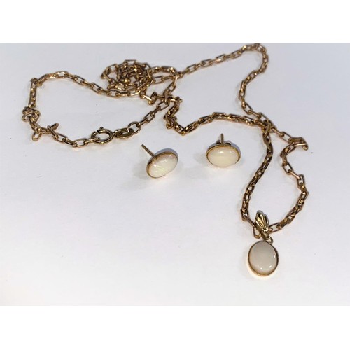 669 - An oval opal style pendant on 9 carat hallmarked gold chain (4gm) and similar earrings