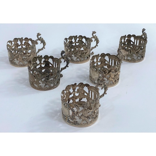 630B - A set of 6 Mappin & Webb silver coffee can holders with extensive pierced and embossed decoration, S... 