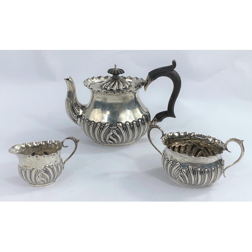 630C - A hallmarked silver bachelor's 3 piece tea set of oval form with gadrooned lower section, Chester 18... 