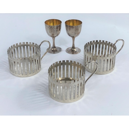 630D - A set of 3 continental white metal glass holders, 6oz., a pair of miniature Far Eastern dwarf goblet... 