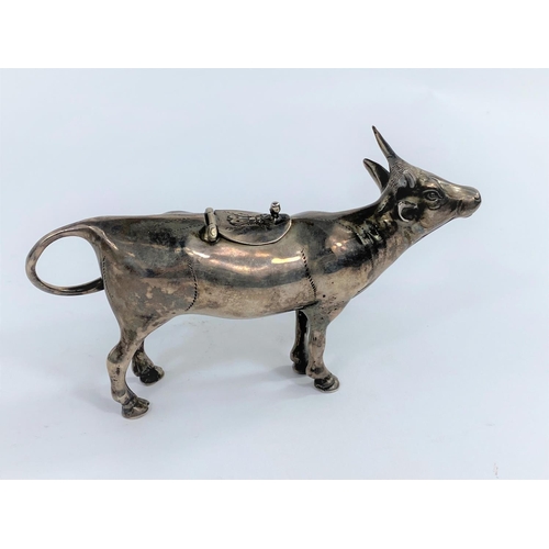 630E - a 19th century continental white metal cow creamer, unmarked, length 14cm