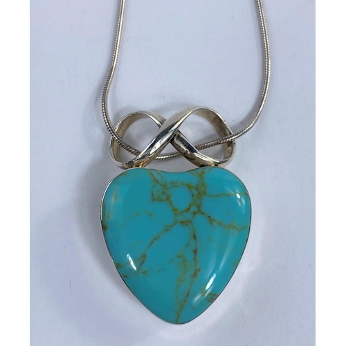 631A - A modern white metal heart pendant set with a turquoise coloured stone, stamped 925.