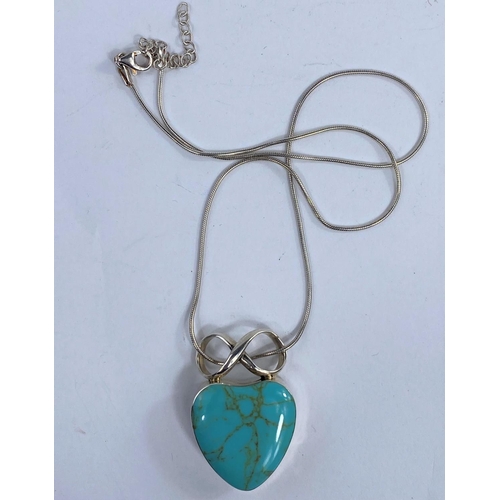 631A - A modern white metal heart pendant set with a turquoise coloured stone, stamped 925.