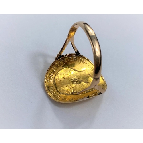 650D - A ring formed from a George V half sovereign on soldered shank st 9ct, 4gm gross (shank split)size K