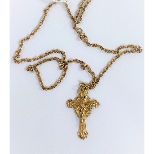 651D - A 9ct gold crucifix pendant with Jesus in relief with etched crown of thorns to the reverse, on a 9c... 