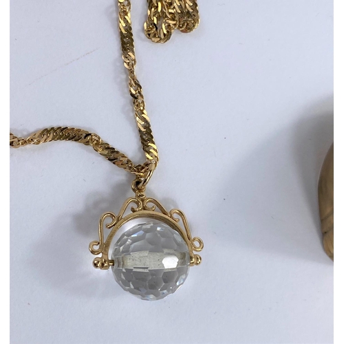 651B - A 9ct gold chain with faceted crystal glass ball pendant gross weight 7.2 gms and a brass gents sign... 
