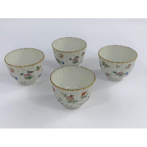 611C - Four Chinese tea bowls of ribbed form decorated in
polychrome with detailed flowers and insects, wit... 