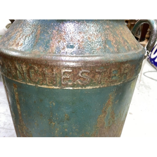 518A - A vintage cast metal Manchester Co-op society milk churn converted into planter with vintage enamel ... 