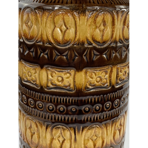 519A - A 1960's / 70's tall cylindrical West German 'lava ware' vase in brown and yellow with ringed decora... 