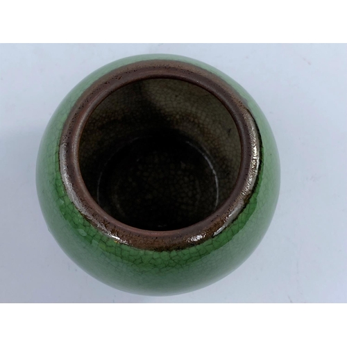 610B - A small globular Chinese monochrome crackle glaze squat globular vase the rim unglazed, height 6.5cm